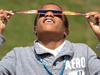 Boy wearing eclipse shades