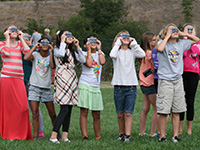 Girls wearing eclipse shades